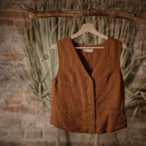 Buttoned linen waistcoat photographer with a boxy fit, two welt pockets and a simple slit at the back | bohemian vest