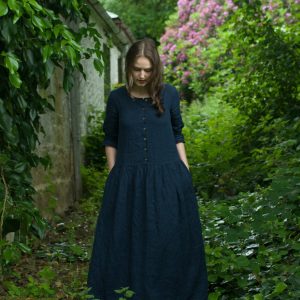 Loose linen dress with a boat neckline and buttoned front